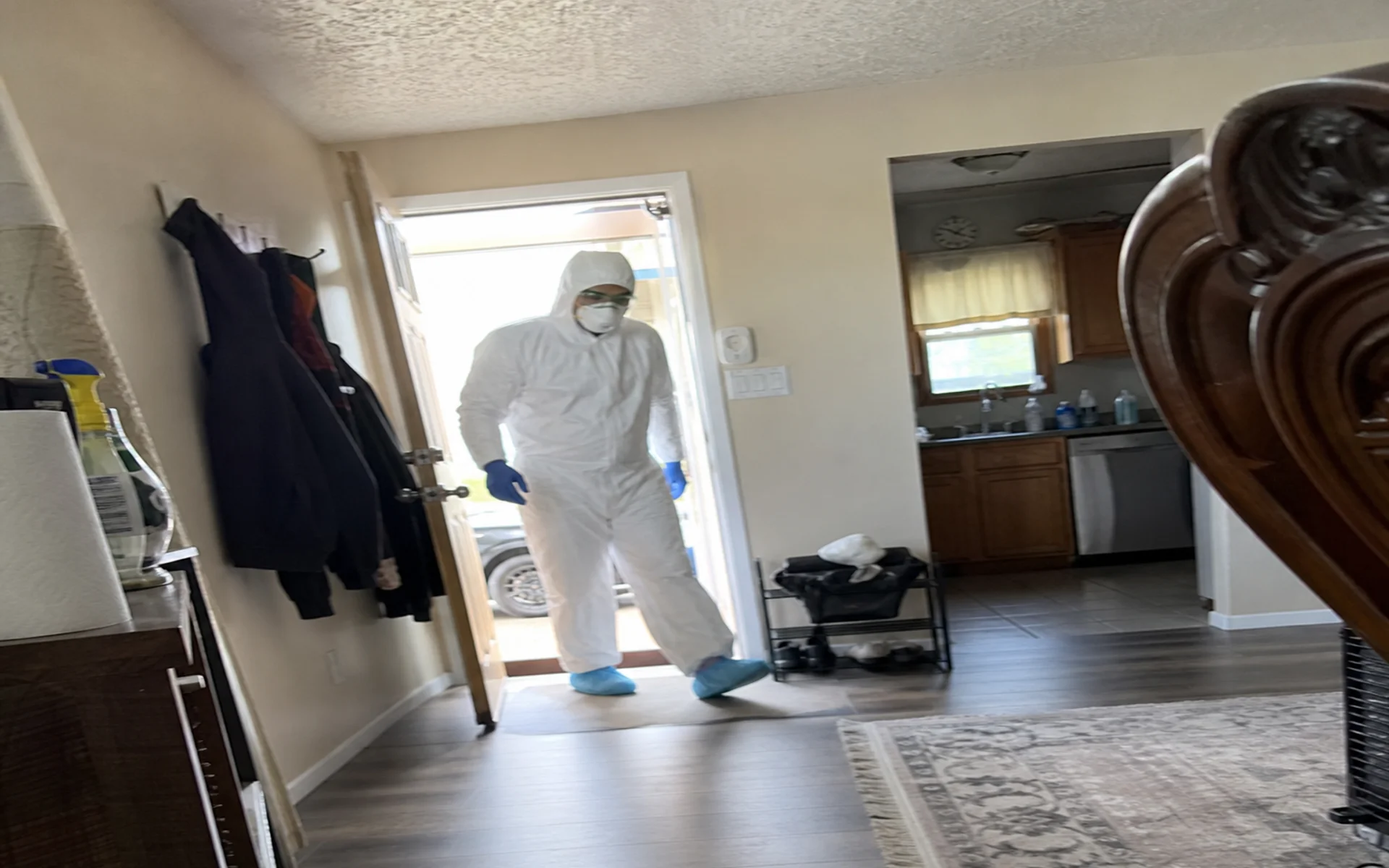 Biohazard cleanup technician in full PPE