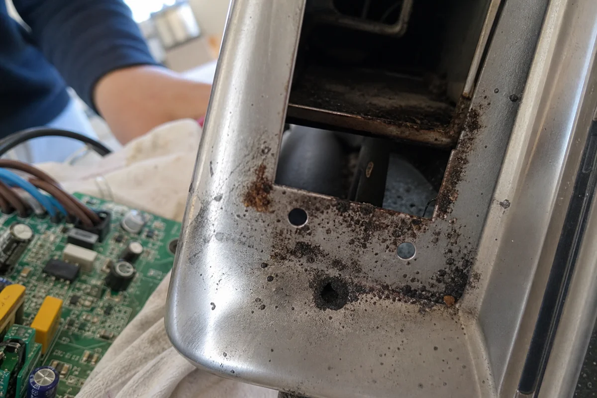 Close-up of corrosive soot on metal fixture