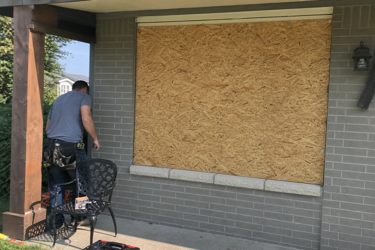 Professionally boarded-up broken window