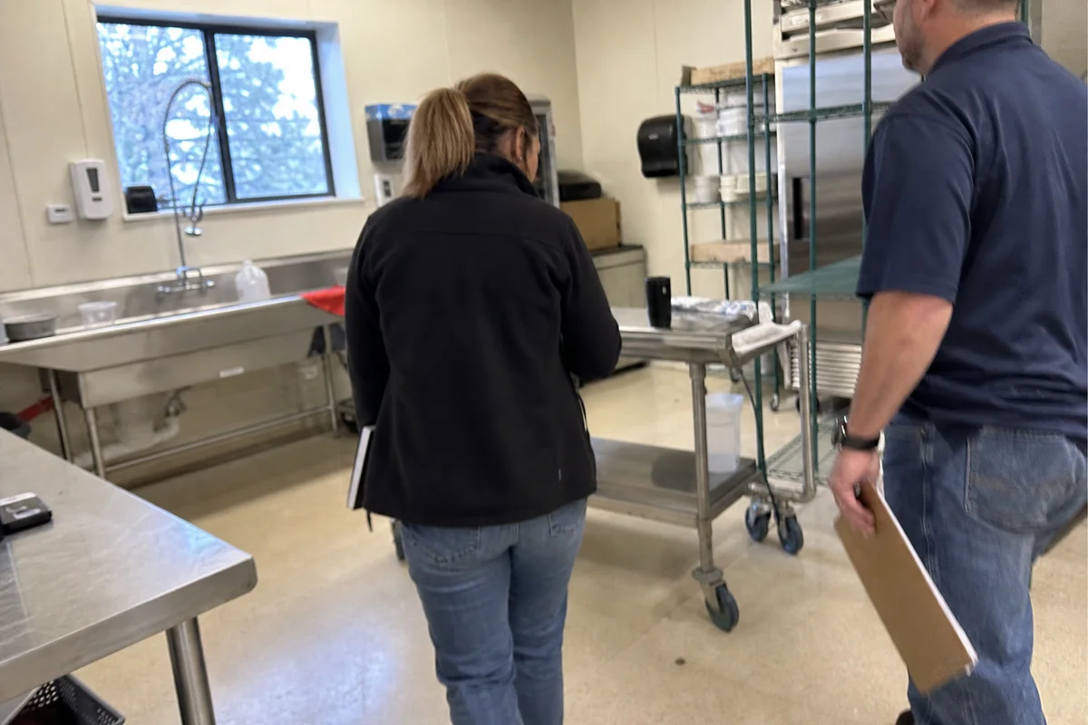 Property manager and restoration rep on facility walkthrough