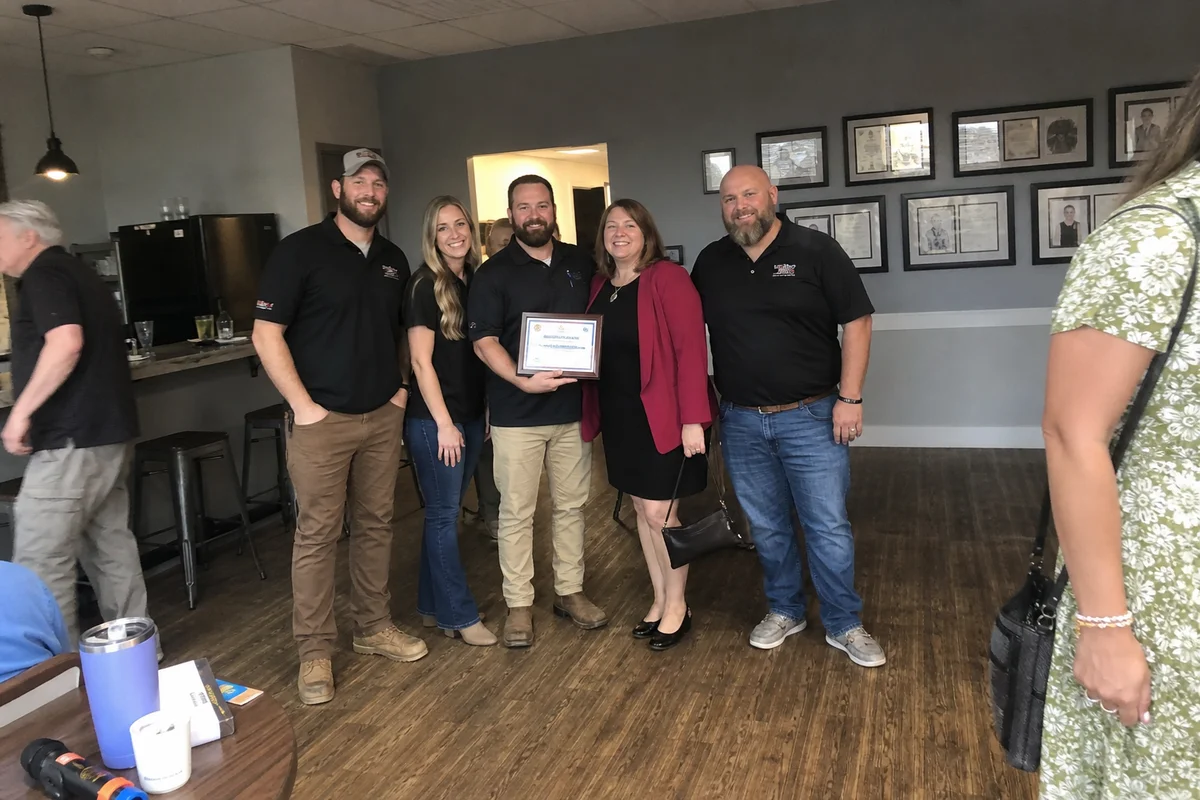 Team with Castle Rock Chamber Business of the Month plaque