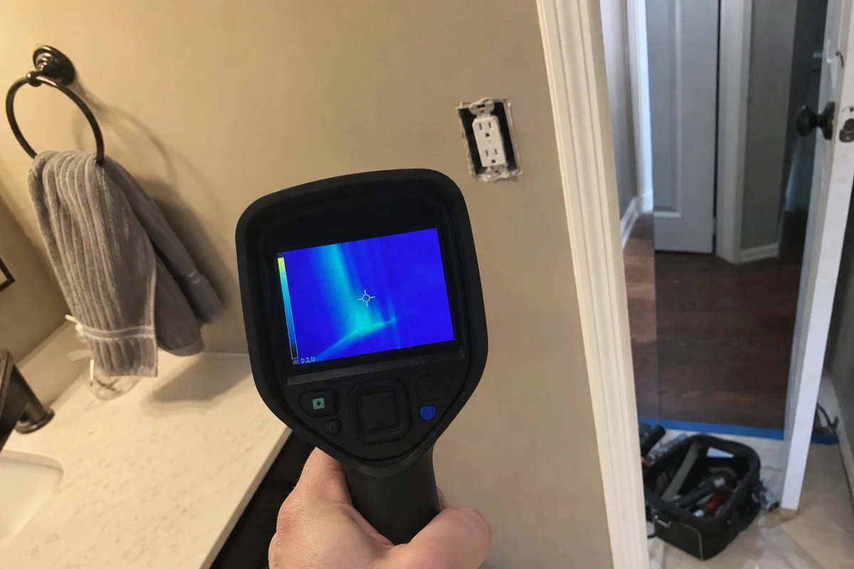 Thermal imaging showing hidden water behind a wall